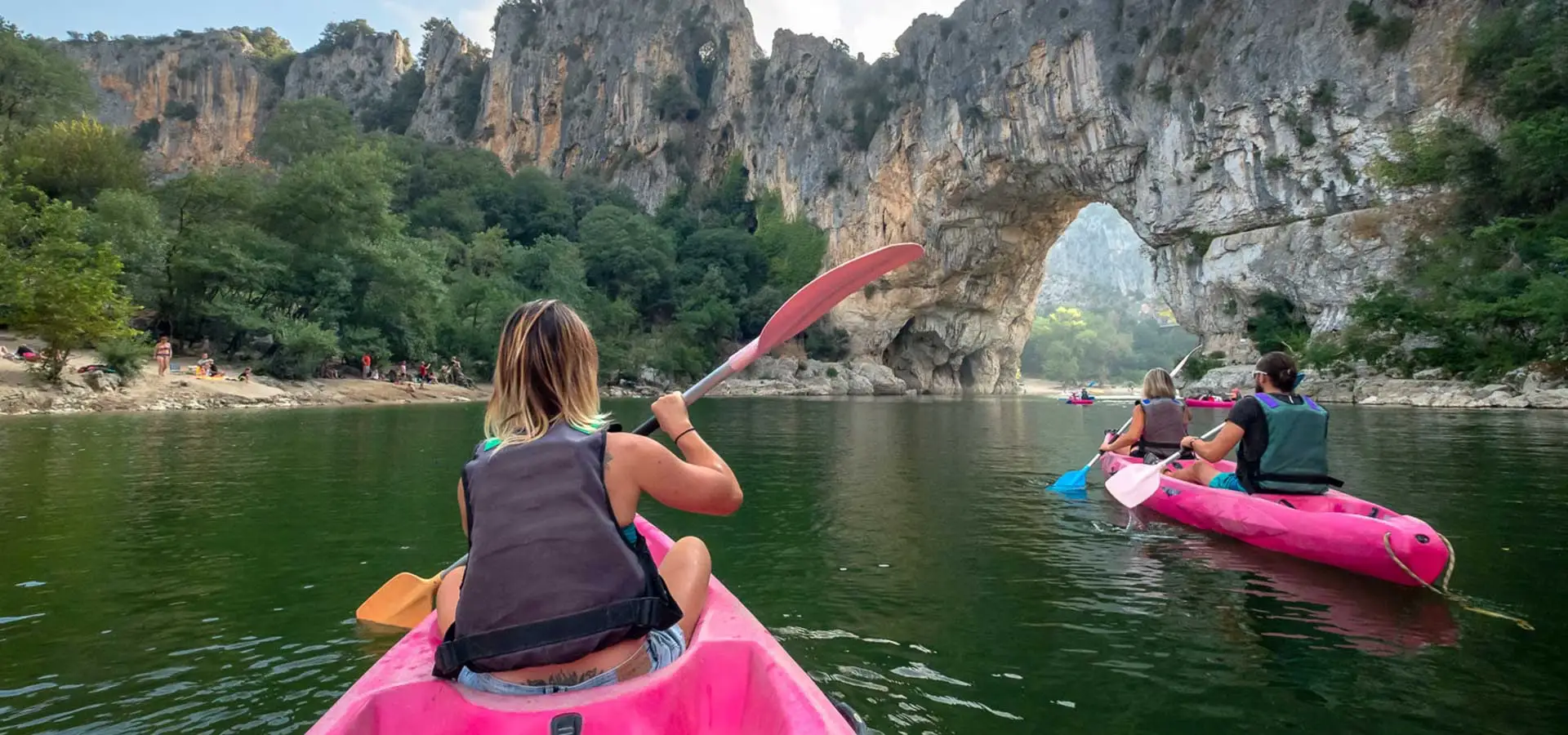 Kayaks on the river under the Pont d’Arc arch